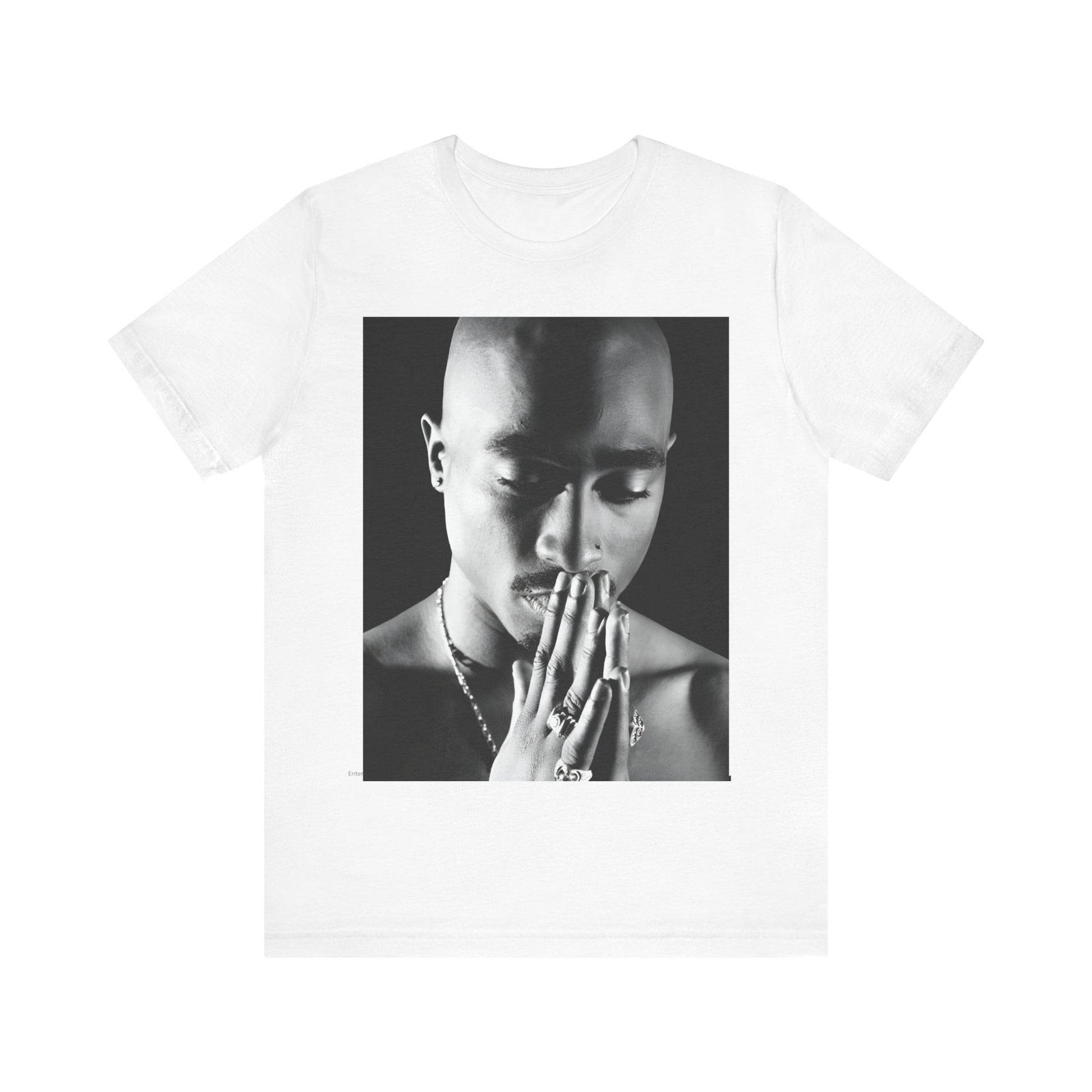A black graphic t-shirt featuring a black and white streetwear rebel graphic of Tupac.