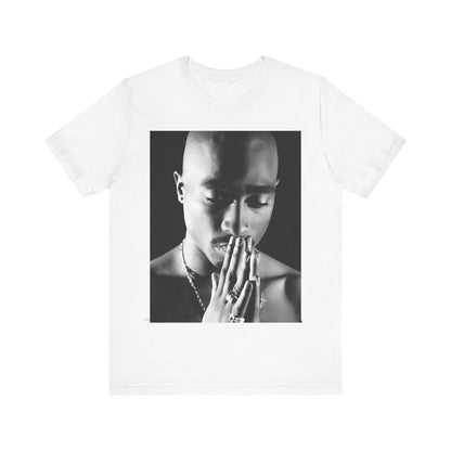 A black graphic t-shirt featuring a black and white streetwear rebel graphic of Tupac.