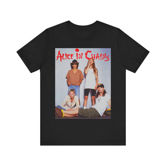A black graphic t-shirt featuring a band graphic of Alice In Chains from 1990, capturing their early grunge aesthetic.
