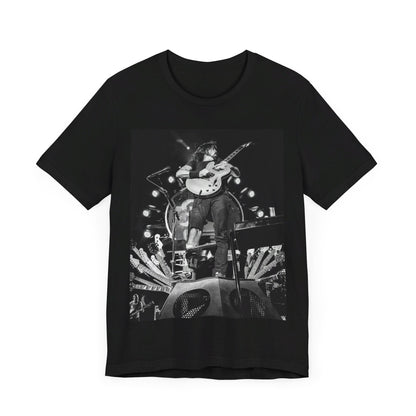 A black graphic t-shirt featuring a vintage photo of Foo Fighters performing live.