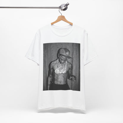 A black graphic t-shirt featuring a graphic of Travis Scott as the Houston rap king.