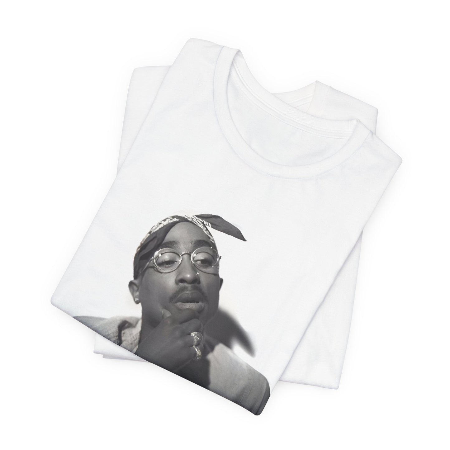 A black graphic t-shirt featuring a classic 90s West Coast rap graphic of Tupac.
