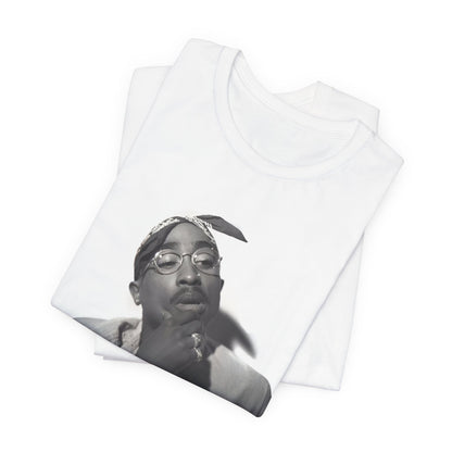 A black graphic t-shirt featuring a classic 90s West Coast rap graphic of Tupac.