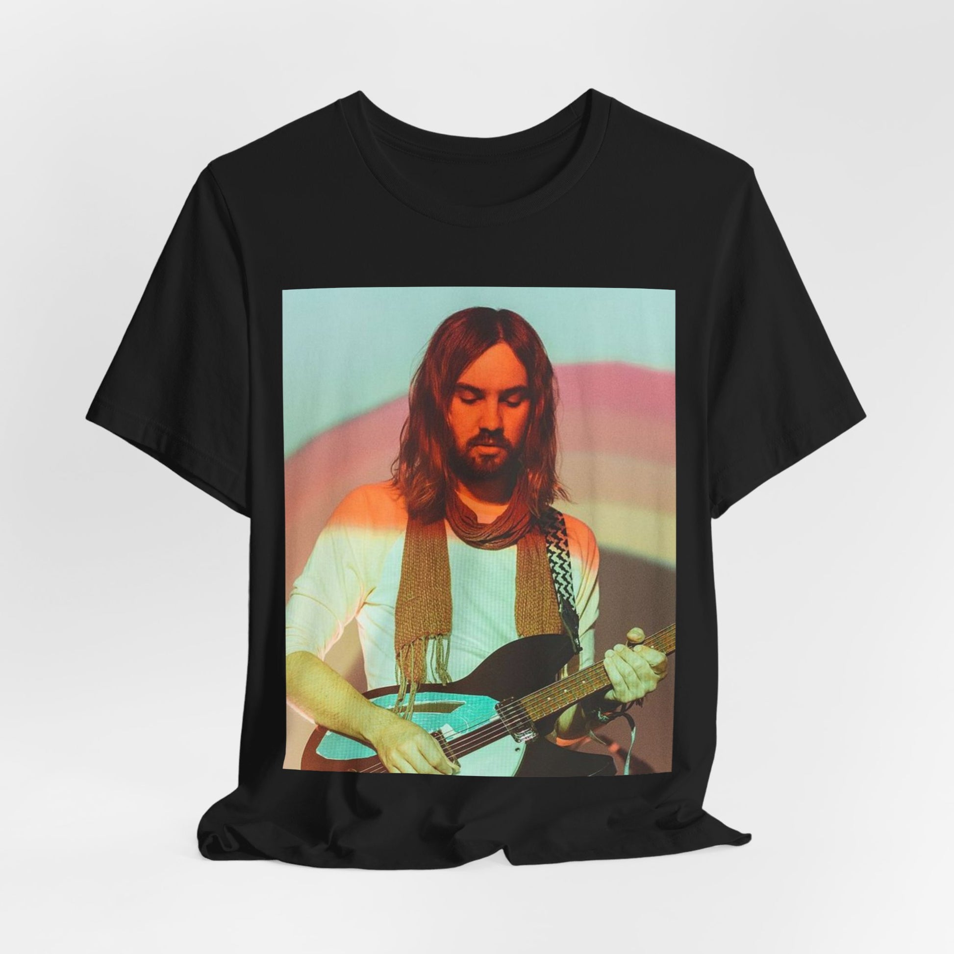 A black graphic t-shirt featuring a dream rock aesthetic graphic of Tame Impala.