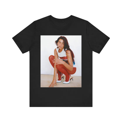 A black graphic t-shirt featuring a graphic of Dua Lipa with a chill pop vibe, designed for comfort.