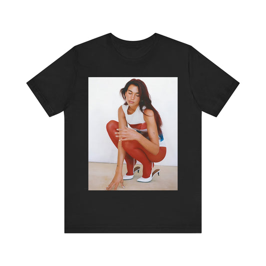 A black graphic t-shirt featuring a graphic of Dua Lipa with a chill pop vibe, designed for comfort.