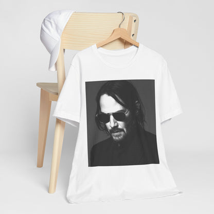 A black graphic t-shirt featuring a graphic of Keanu Reeves with a rebel spirit aesthetic.