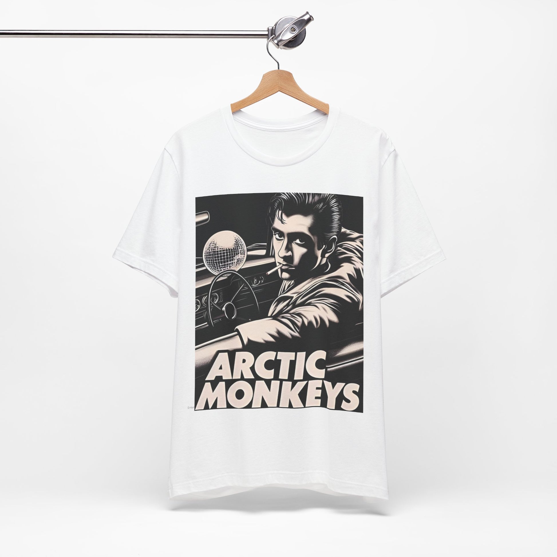 A black graphic t-shirt featuring a graphic of Arctic Monkeys from the 2000s, evoking an indie rock aesthetic.