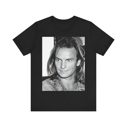 A black graphic t-shirt featuring a retro graphic related to Sting's 'Synchronicity' album era.
