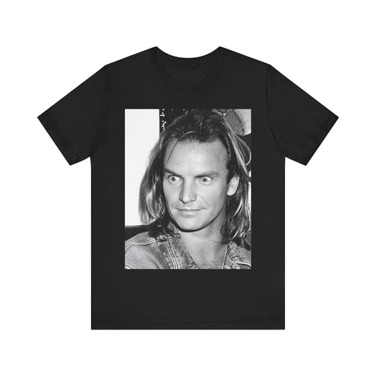 A black graphic t-shirt featuring a retro graphic related to Sting's 'Synchronicity' album era.