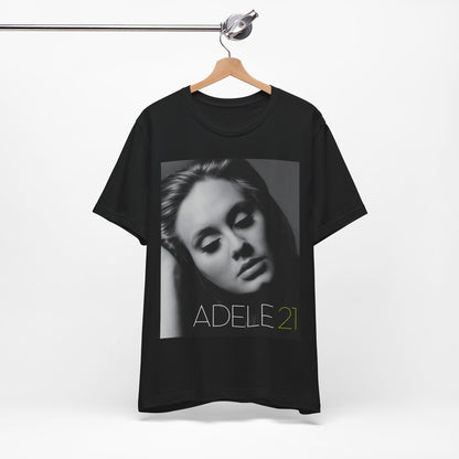 A black graphic t-shirt featuring the album cover art for Adele's '21' album, showing a close-up portrait of her with a contemplative expression.