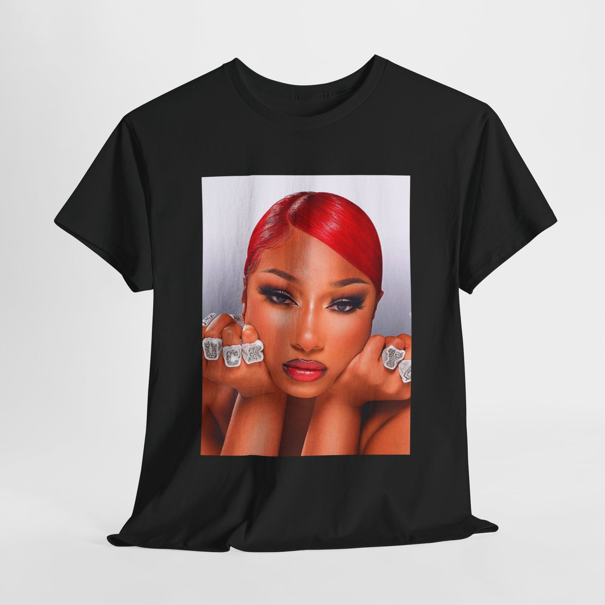 A black graphic t-shirt featuring a bold graphic of Megan Thee Stallion as a rap superstar.