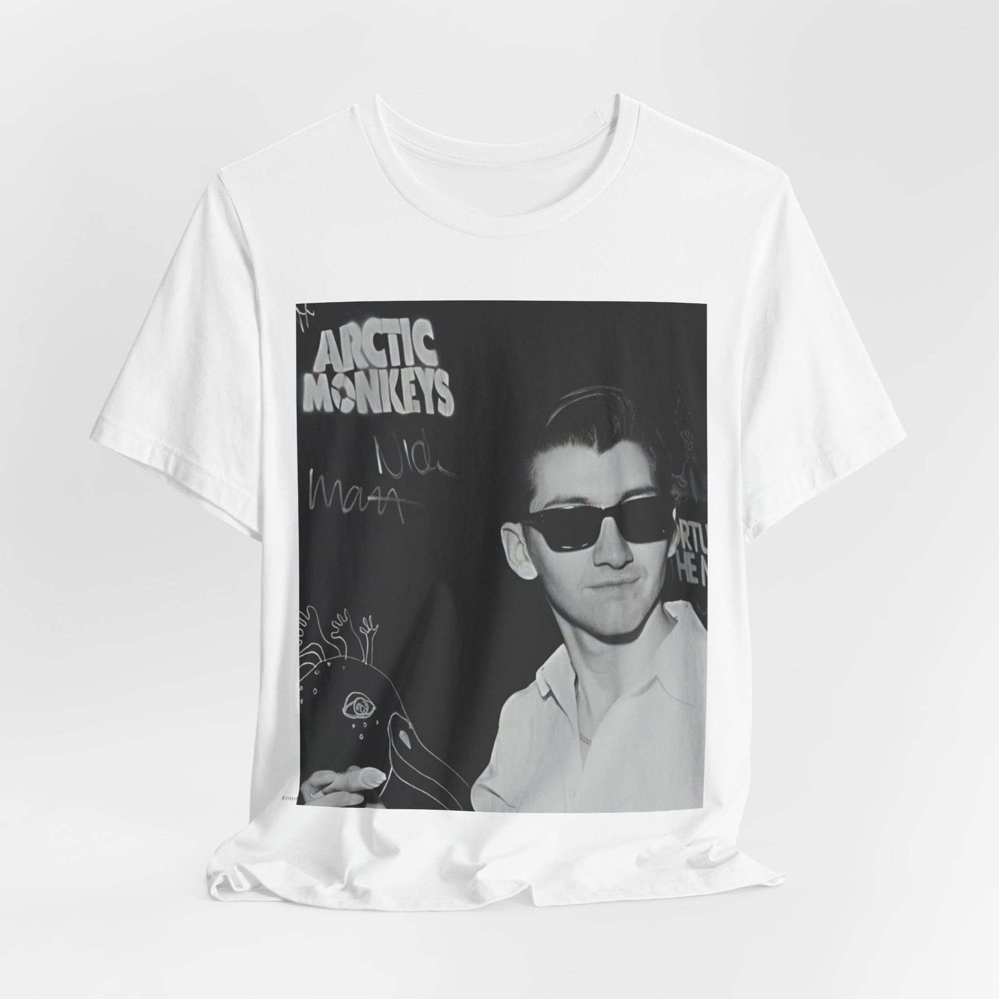 A black graphic t-shirt featuring a black and white portrait photo of Alex Turner from Arctic Monkeys, showing his signature look.