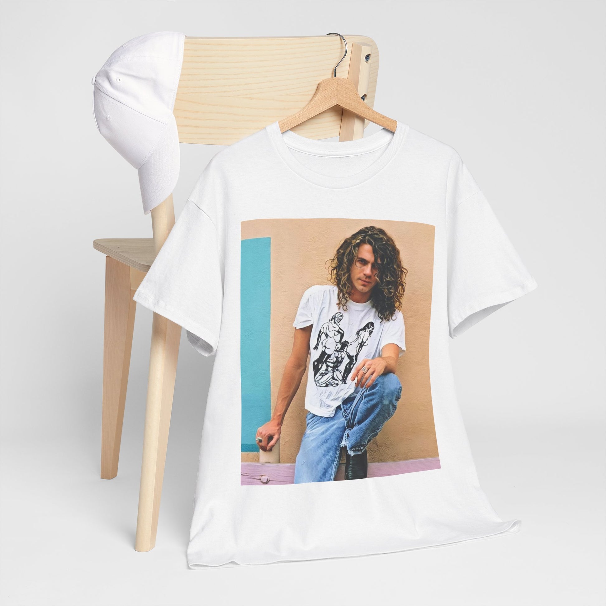 A black graphic t-shirt featuring a 90s chill retro rock graphic of INXS.