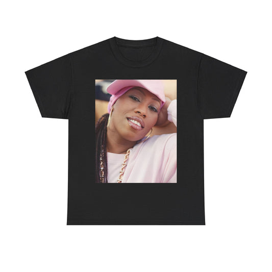A black graphic t-shirt featuring a 90s rap graphic of Missy Elliott from her early days, emphasizing a raw style.