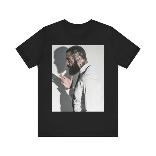 A black graphic t-shirt featuring a graphic of Post Malone with his classic face tattoos.