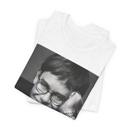 A black graphic t-shirt featuring a retro black and white photo portrait of Elton John.