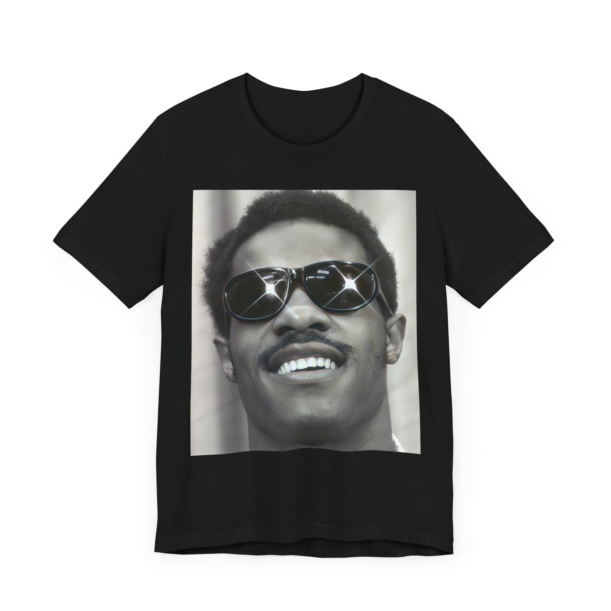 A black graphic t-shirt featuring a 70s funk aesthetic black and white graphic or photo of Stevie Wonder.
