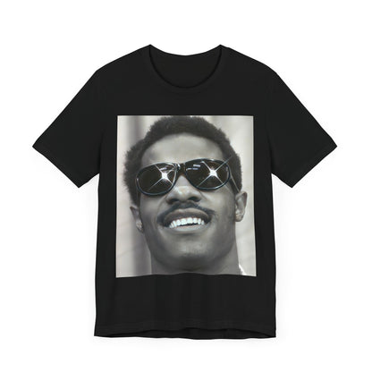 A black graphic t-shirt featuring a 70s funk aesthetic black and white graphic or photo of Stevie Wonder.
