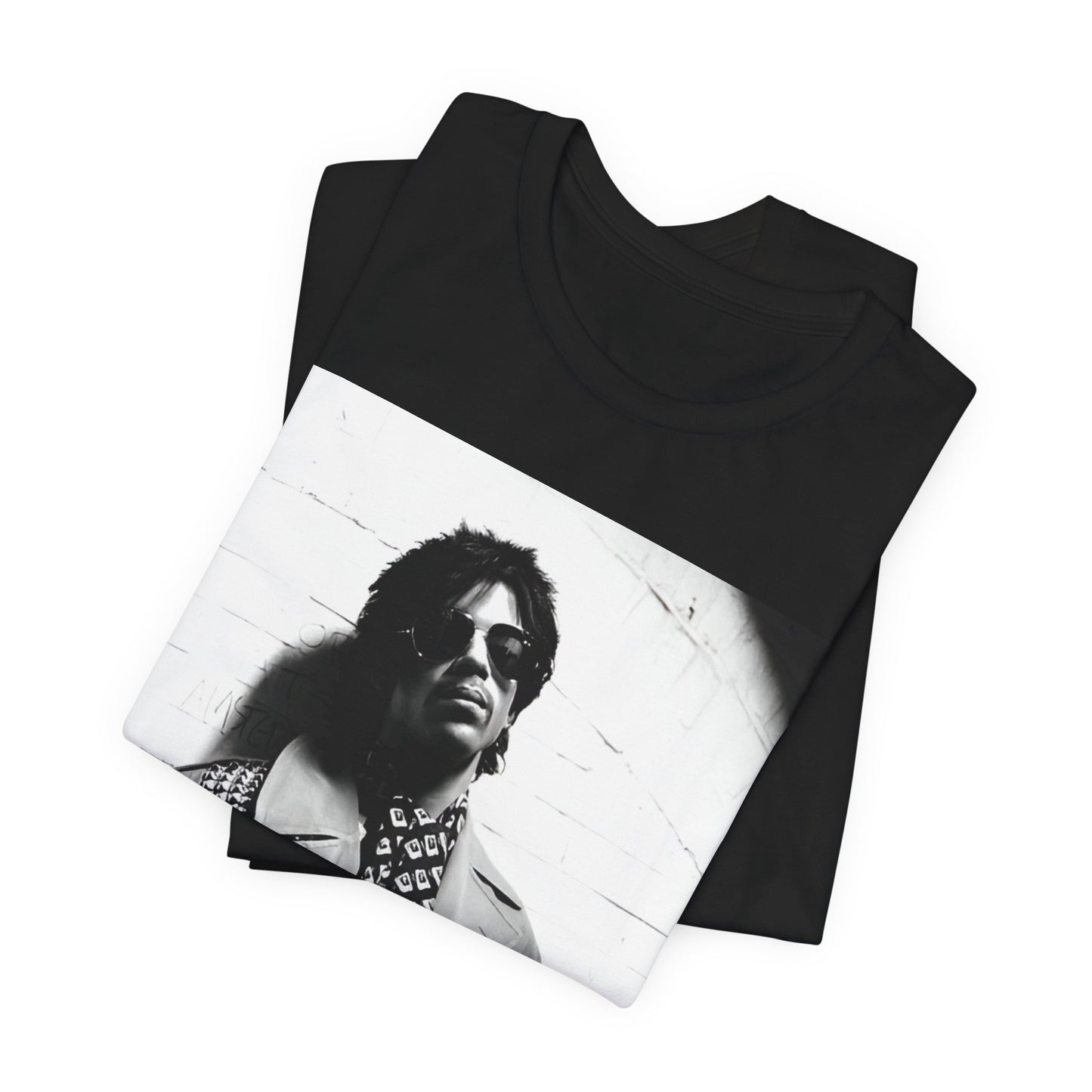 A black graphic t-shirt featuring Prince's iconic symbol, representing 'The Artist Formerly Known As'.