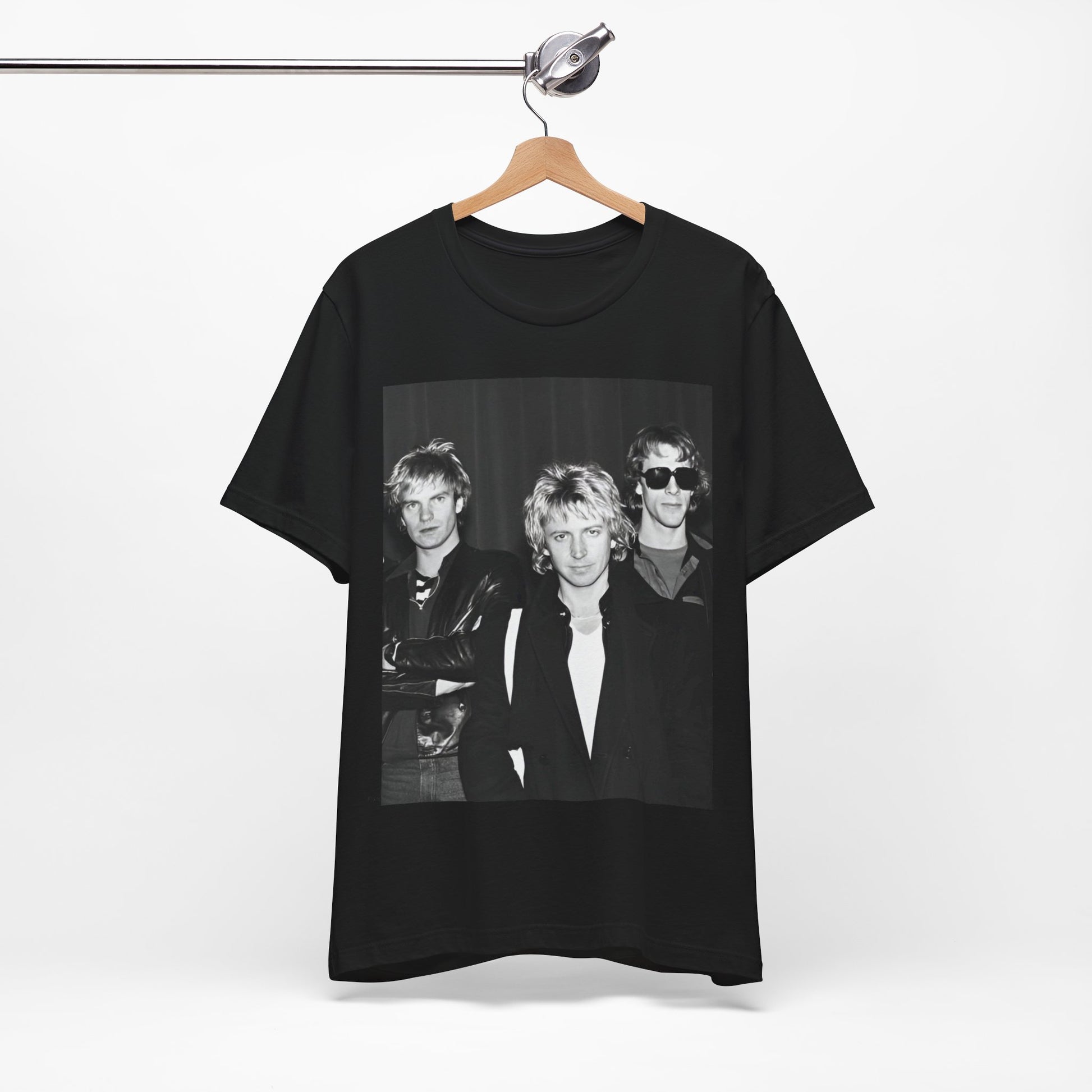 A black graphic t-shirt featuring a black and white, monochrome graphic or photo of The Police.