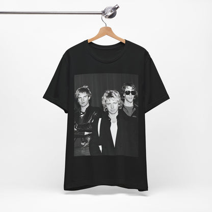 A black graphic t-shirt featuring a black and white, monochrome graphic or photo of The Police.