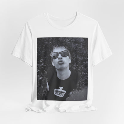 A black graphic t-shirt featuring a retro 90s graphic of Thom Yorke from Radiohead.