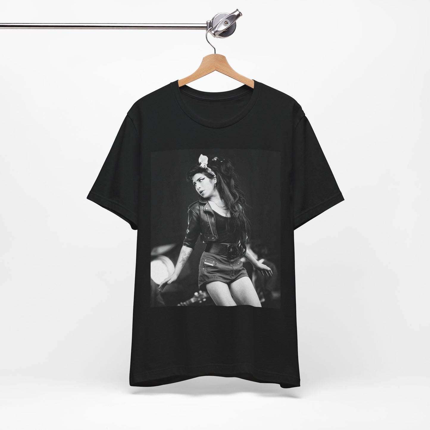 A black graphic t-shirt featuring a graphic related to Amy Winehouse's 'Frank' album era from 2003, possibly with early portrait imagery.