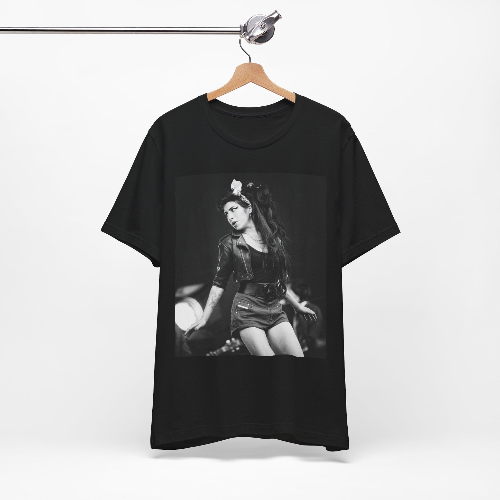 A black graphic t-shirt featuring a graphic related to Amy Winehouse's 'Frank' album era from 2003, possibly with early portrait imagery.