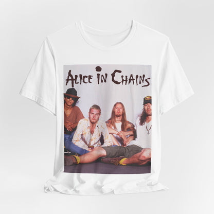 A black graphic t-shirt featuring a classic rock graphic of Alice In Chains from the 1990s, possibly with band members or stylized logo.