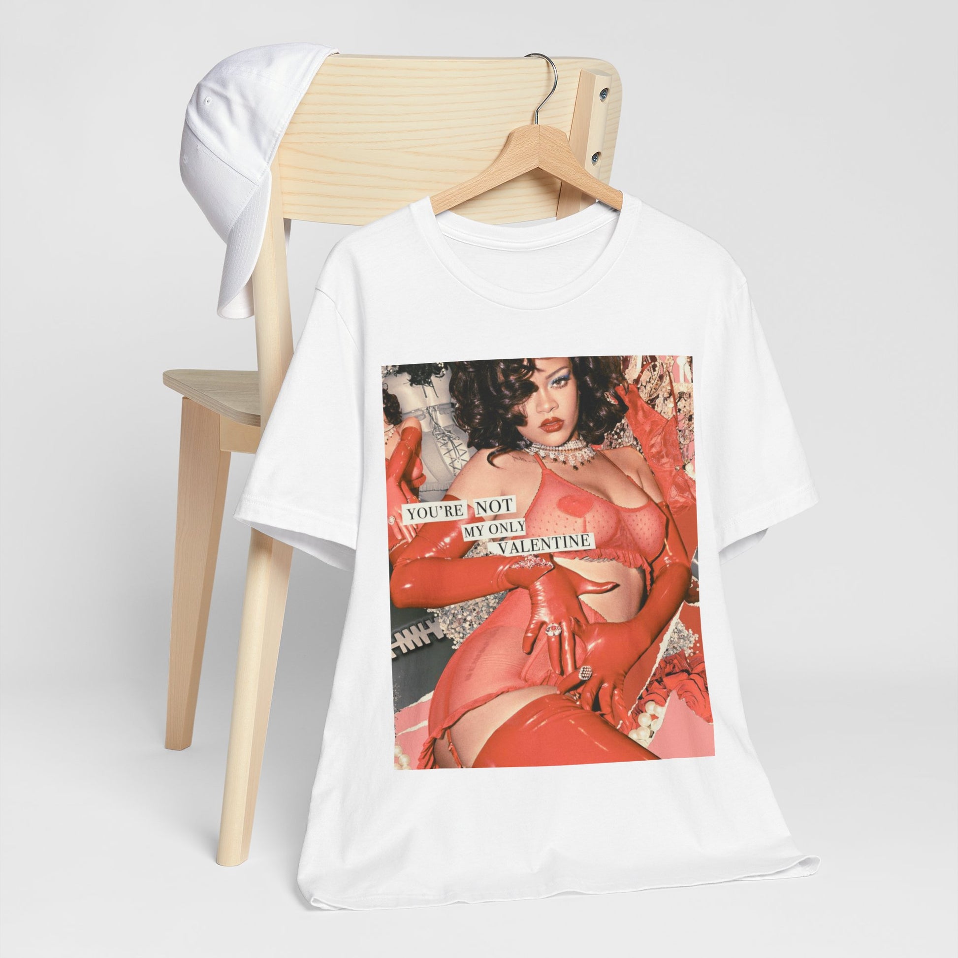 A black graphic t-shirt featuring a graphic of Rihanna with a 'hot valentine' theme.