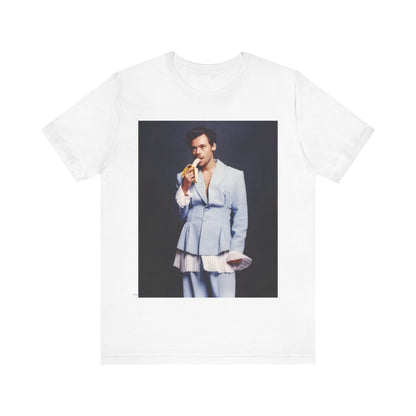 A black graphic t-shirt featuring a graphic related to Harry Styles and his One Direction legacy.
