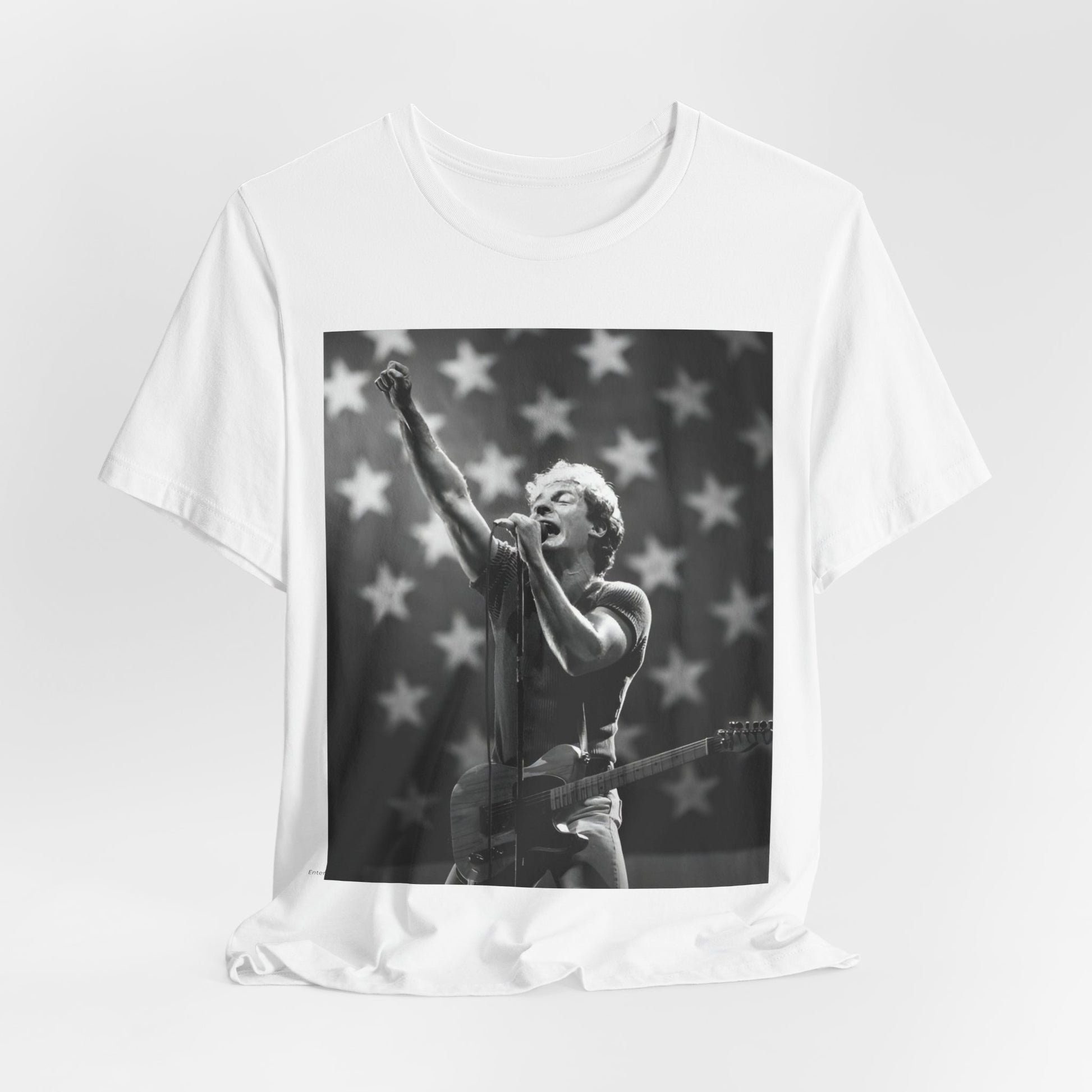 A black graphic t-shirt featuring a 70s era Americana-style graphic of Bruce Springsteen.