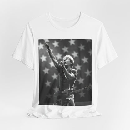 A black graphic t-shirt featuring a 70s era Americana-style graphic of Bruce Springsteen.