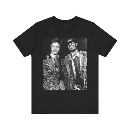 A black graphic t-shirt featuring a retro graphic of Stevie Wonder and David Bowie together.