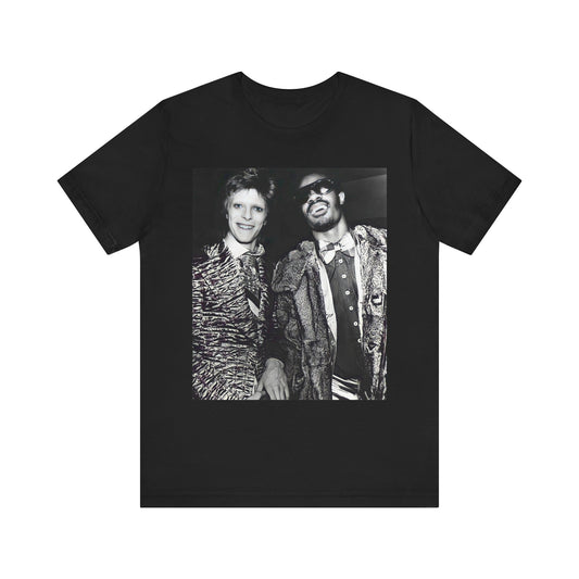 A black graphic t-shirt featuring a retro graphic of Stevie Wonder and David Bowie together.