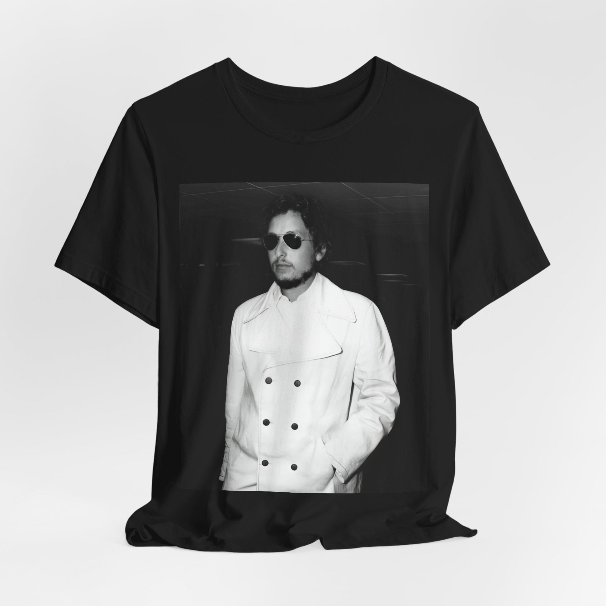 A black graphic t-shirt featuring a vintage black and white photo of Bob Dylan in a contemplative or iconic pose.