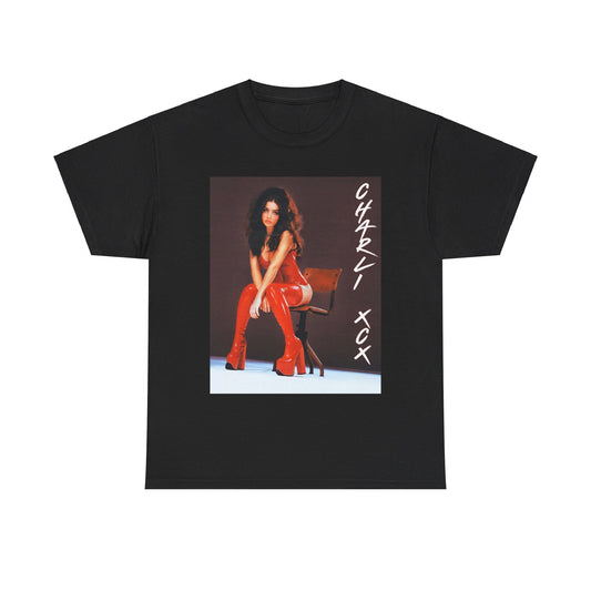 A black graphic t-shirt featuring a stylized graphic of Charli XCX, designed with a modern pop aesthetic.