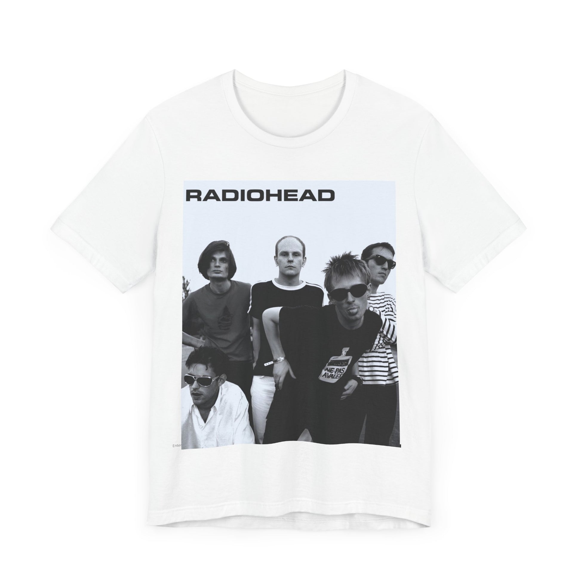 A black graphic t-shirt featuring a vintage 90s graphic related to Radiohead's 'Creep' song or era.
