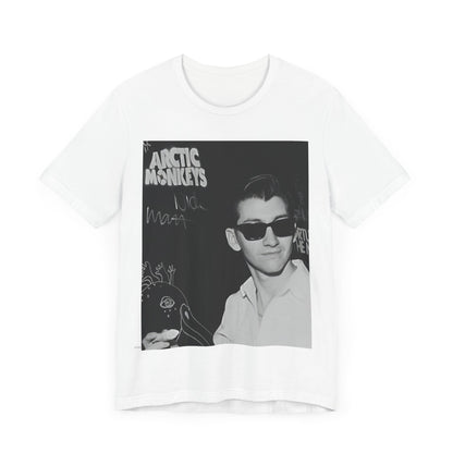 A black graphic t-shirt featuring a black and white portrait photo of Alex Turner from Arctic Monkeys, showing his signature look.