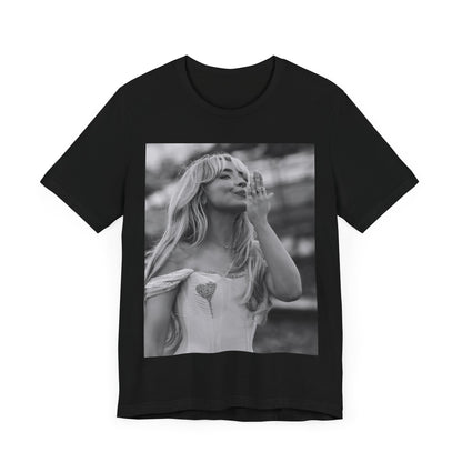 A black graphic t-shirt featuring a graphic or photo of Sabrina Carpenter kissing on stage during a performance.