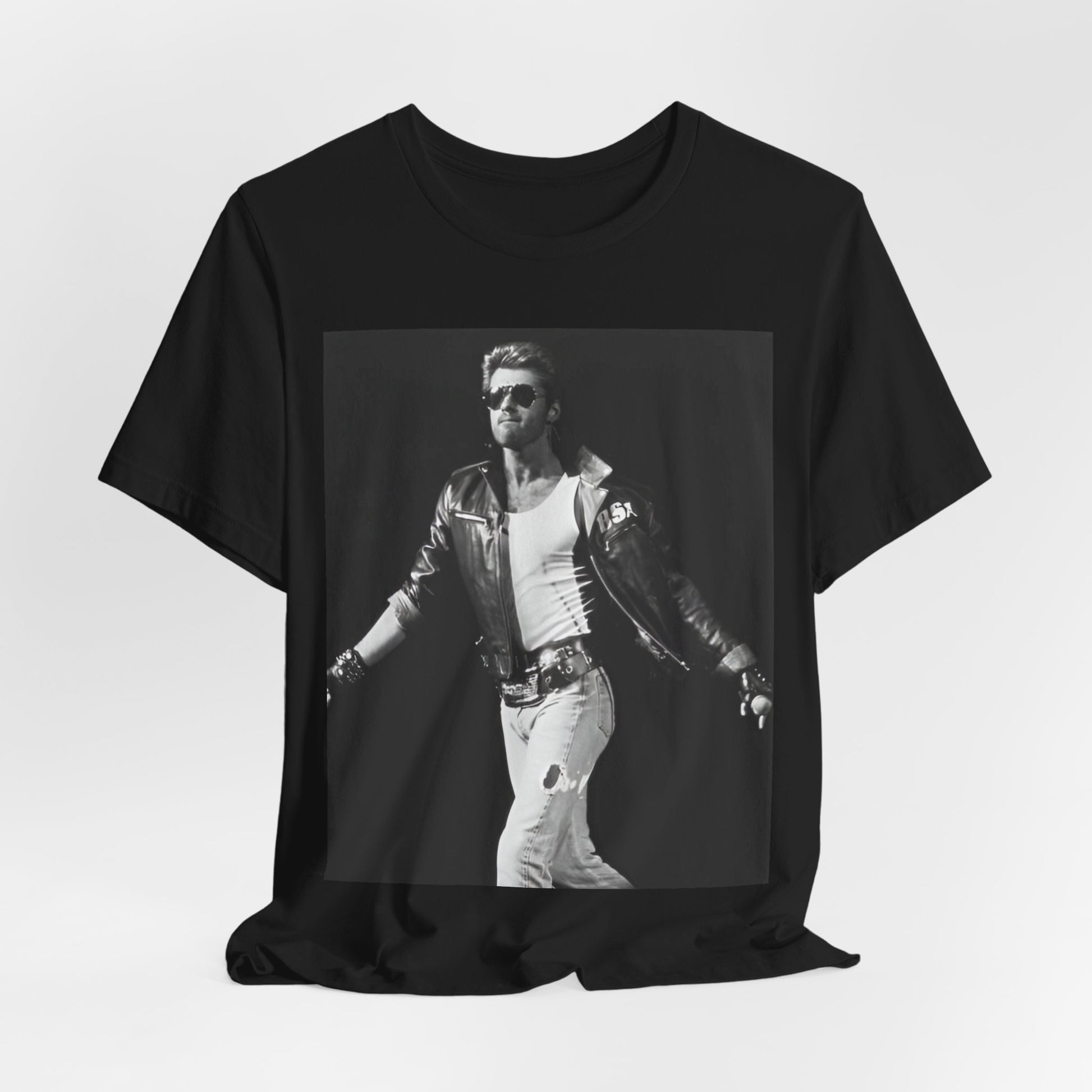 A black graphic t-shirt featuring a retro black and white monochrome graphic or photo of George Michael.