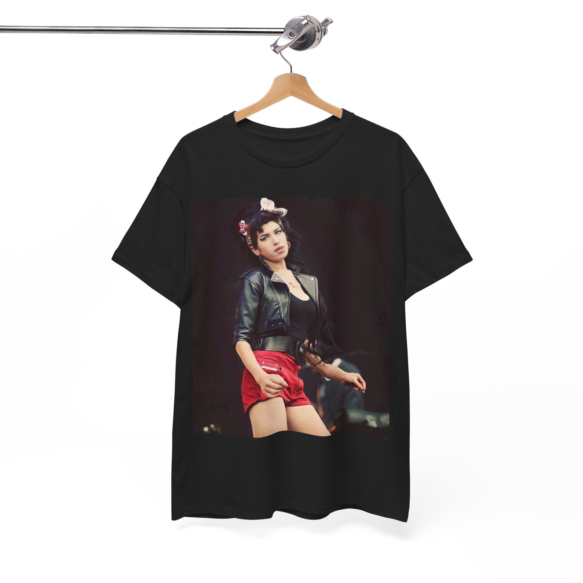 A black graphic t-shirt featuring a photo or illustration of Amy Winehouse on stage, with leather elements and a prominent red background or lighting.