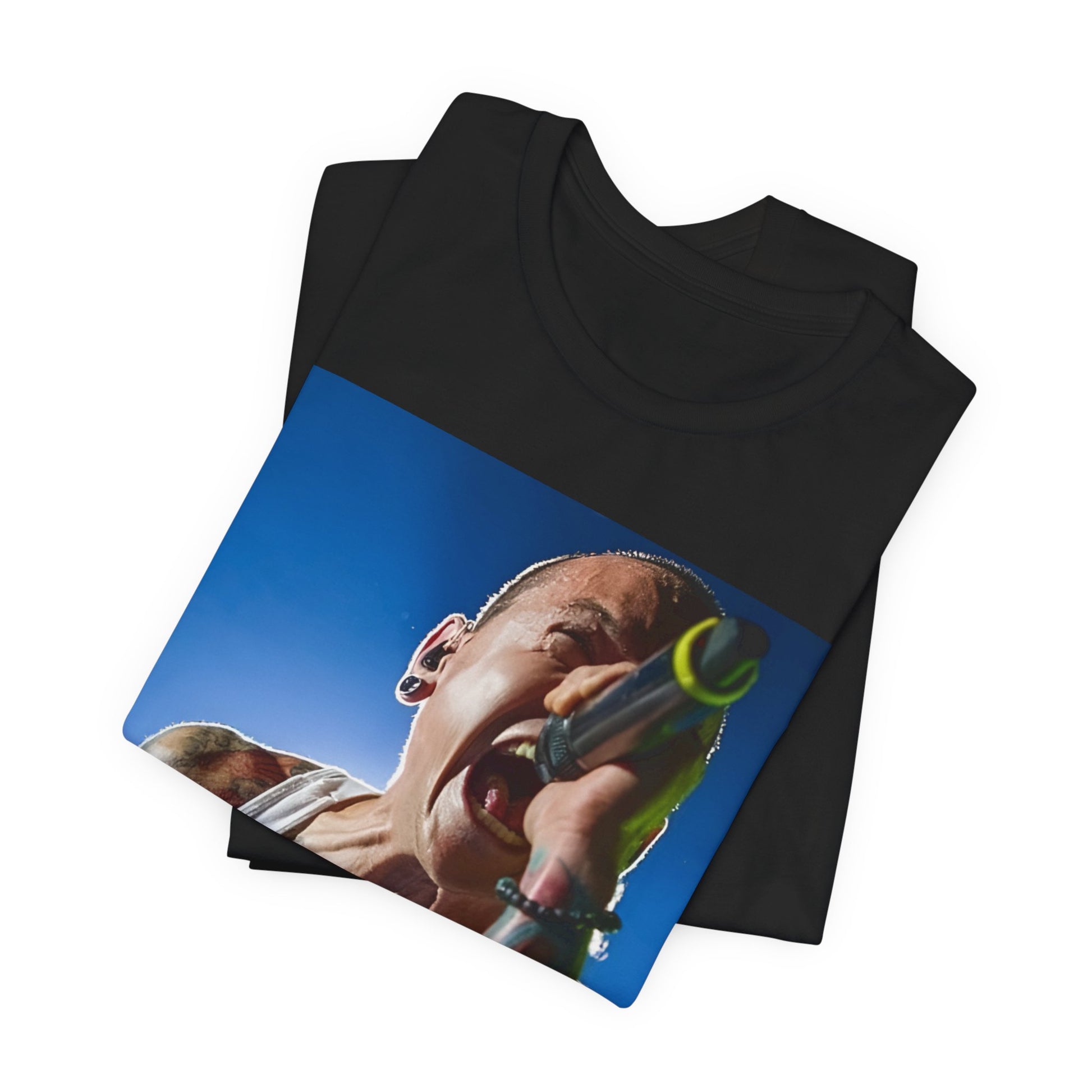 A black graphic t-shirt featuring a retro graphic of Linkin Park performing live.