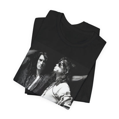 A black graphic t-shirt featuring a dynamic photo or illustration of Aerosmith's Steven Tyler and Joe Perry performing together on stage, highlighting their synergy.
