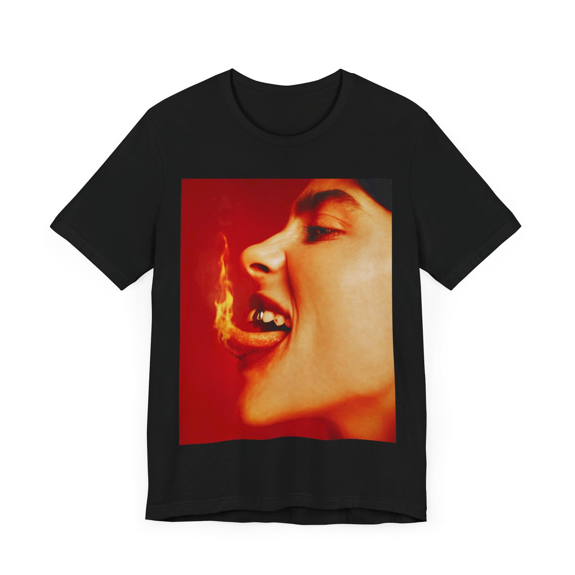 A close-up, red-toned photo of a face in profile with its mouth open and a live flame on the tongue, printed on a graphic t-shirt.