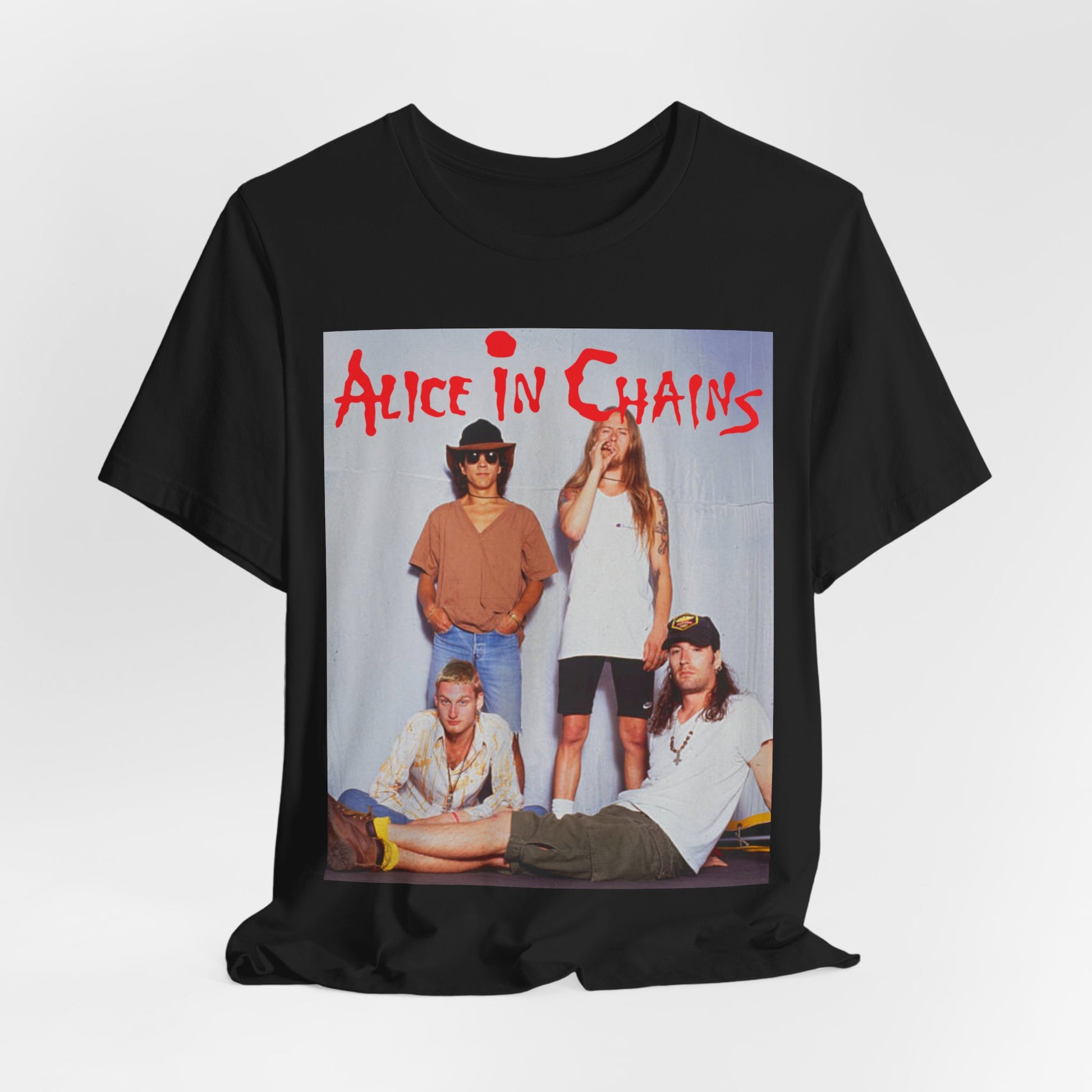 A black graphic t-shirt featuring a band graphic of Alice In Chains from 1990, capturing their early grunge aesthetic.