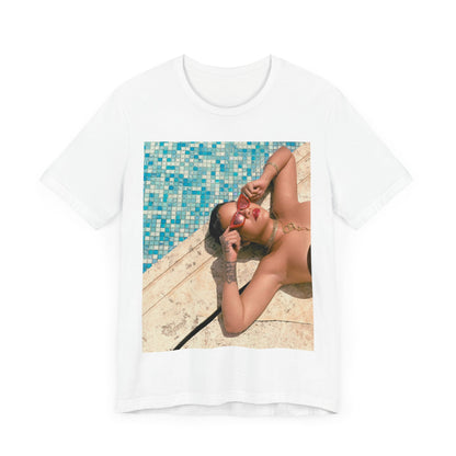 A black graphic t-shirt featuring a graphic of Rihanna in swimwear as a pop star queen.