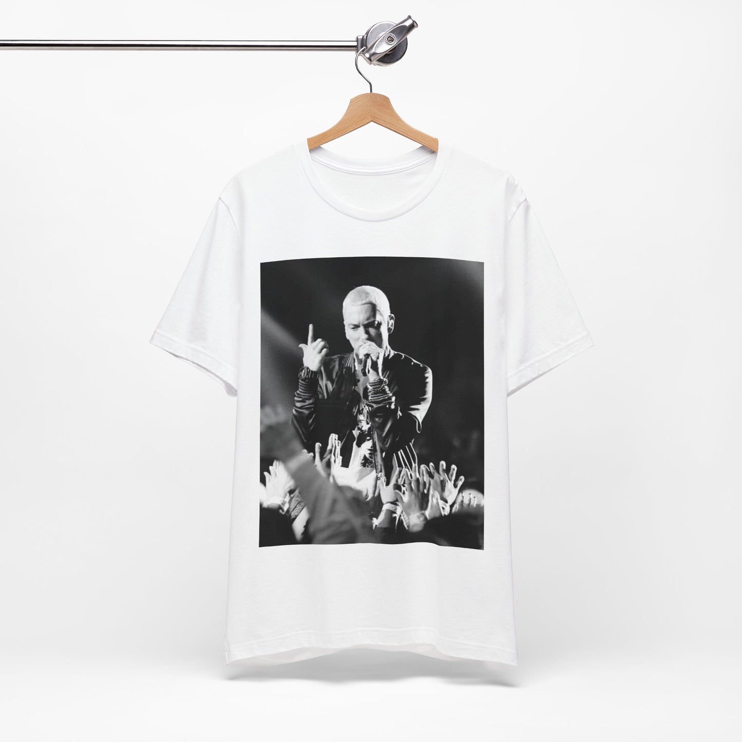 A black graphic t-shirt featuring a graphic or photo of Eminem performing live on stage.