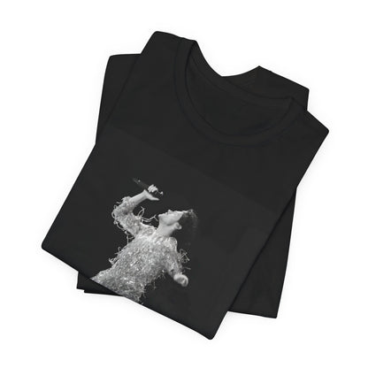 A black graphic t-shirt featuring a boxy pop aesthetic graphic of Harry Styles.